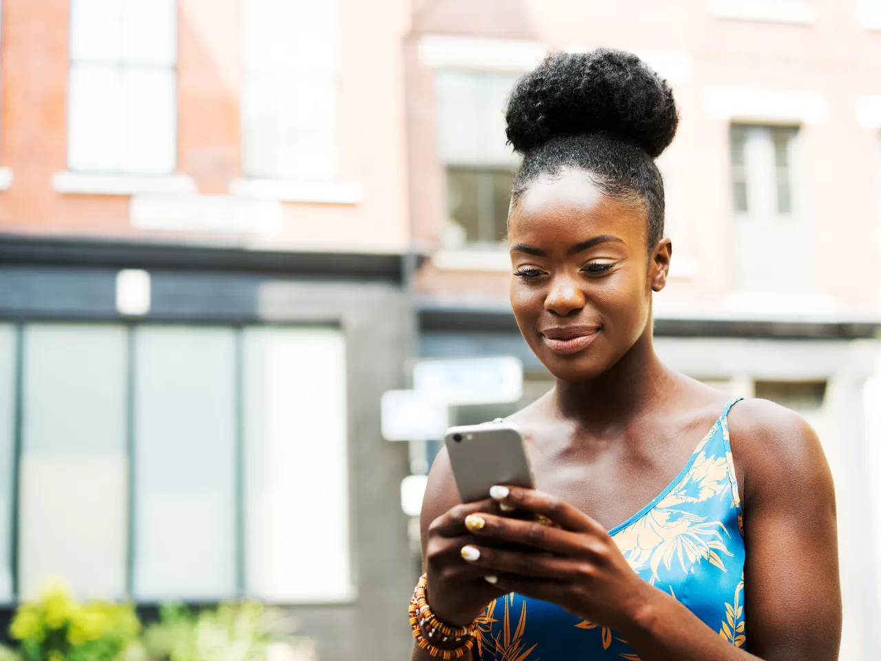 Woman receiving job posting on mobile phone short codes program