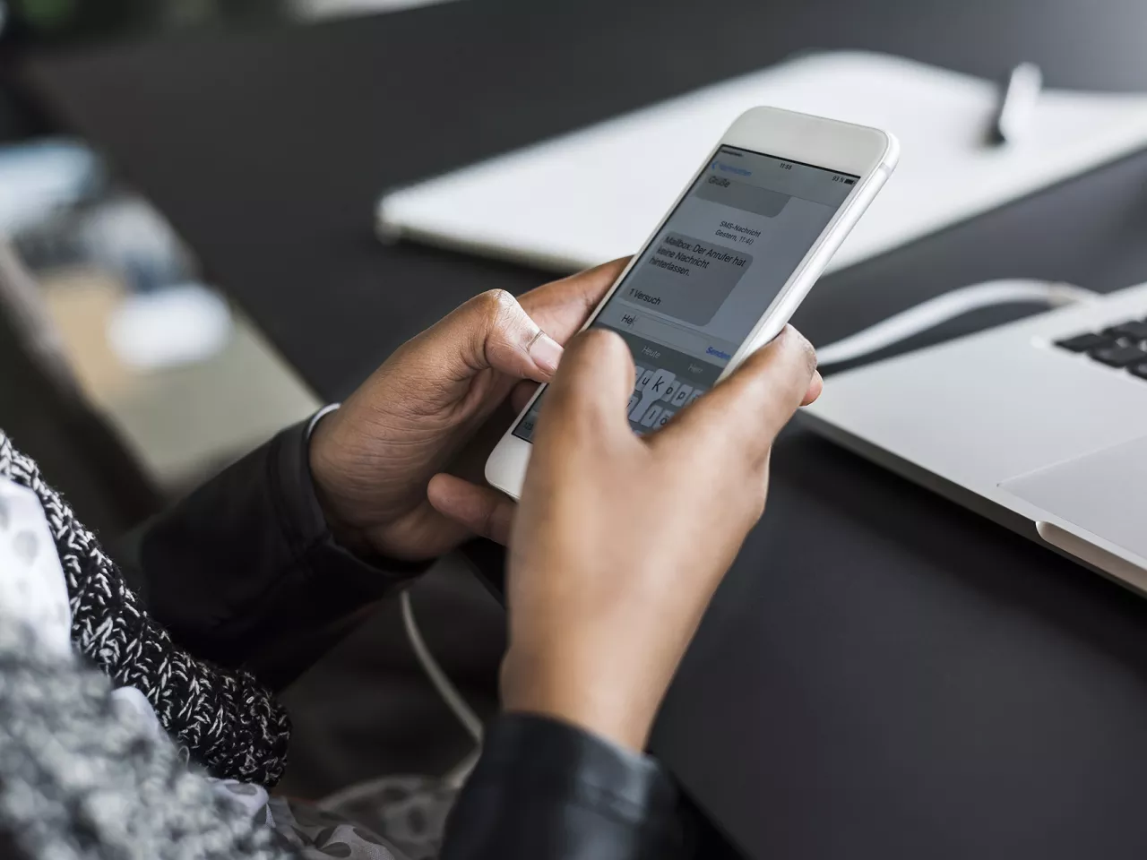 Close up of a person responding to a short code on their phone